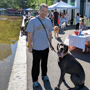 dog and owner at frog pond at barks and bagels